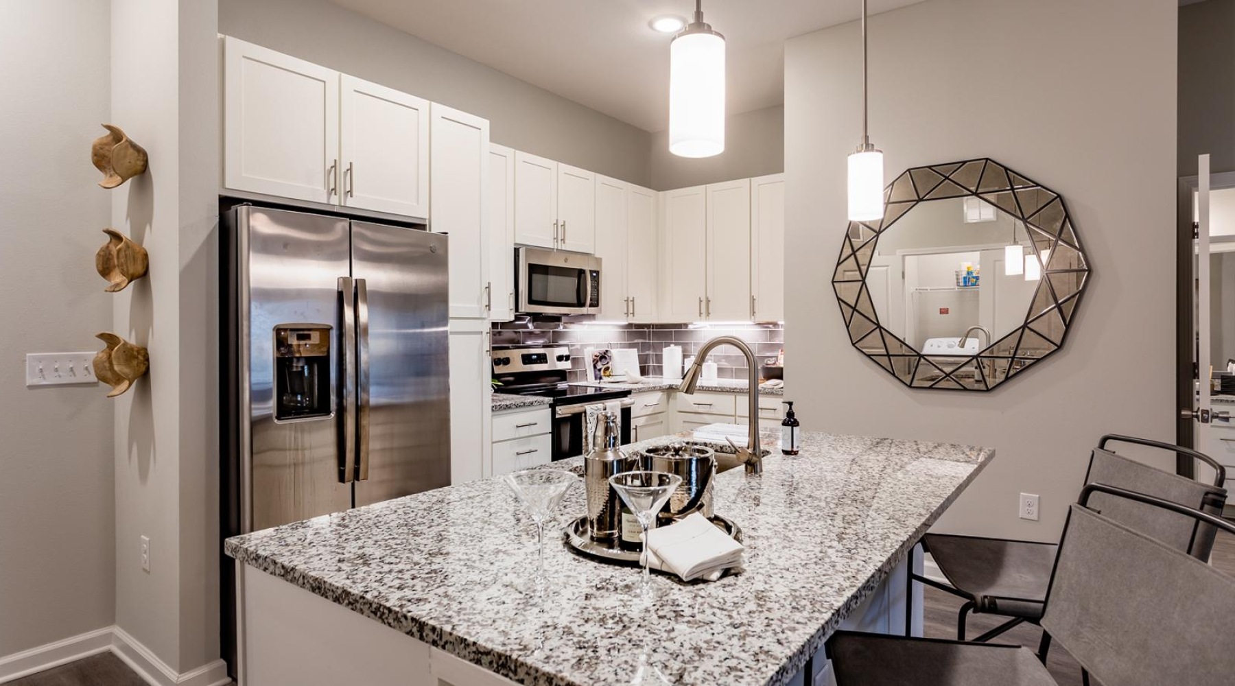 a kitchen with a marble counter top