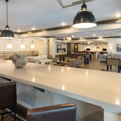 a clubroom with tables and chairs